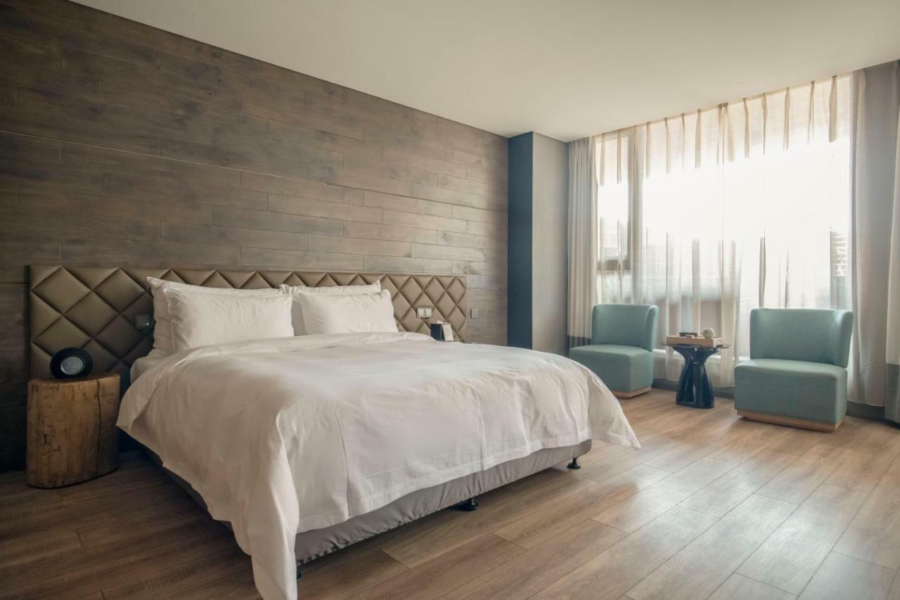 M Hotel Zhengzhou Bagian luar foto